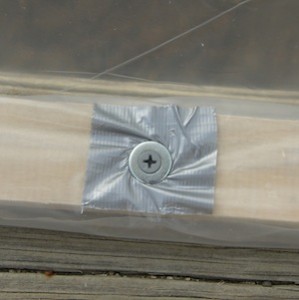 No project of mine is complete without some duct tape, this time used to reinforce the plastic where I screwed it down.