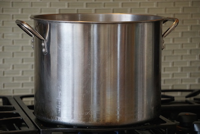 The milk is slowly heated to 90°.  Add starter and rennet.  Then wait.  I stared at this pot for a LONG time.